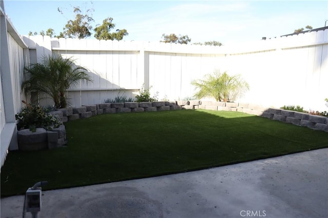 view of yard with a fenced backyard