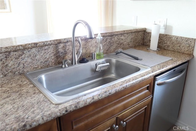 room details featuring a sink and dishwasher