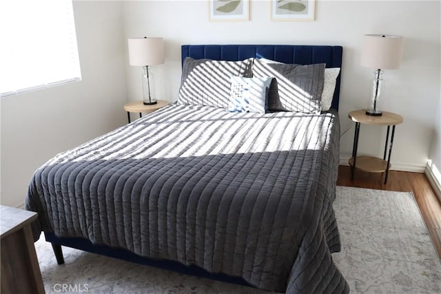 bedroom with wood finished floors