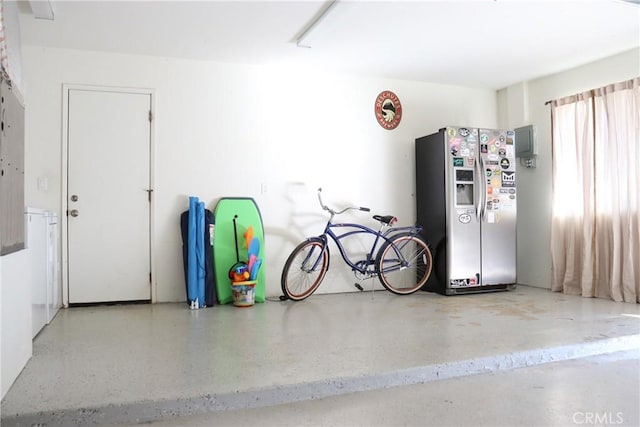 garage with stainless steel fridge