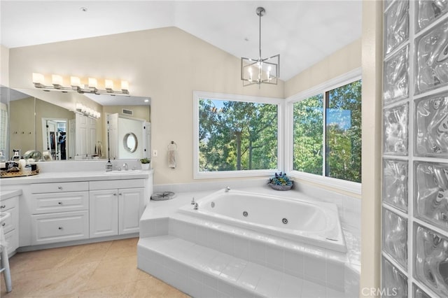 full bathroom with a wealth of natural light, lofted ceiling, visible vents, and a tub with jets