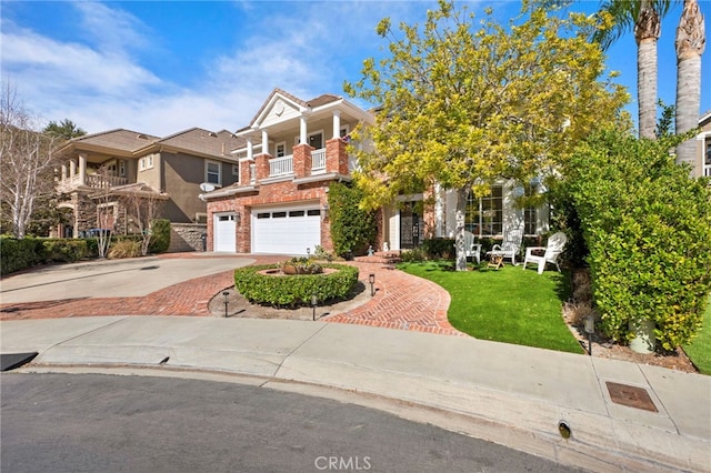 view of front of house with driveway, a garage, a balcony, a front lawn, and brick siding