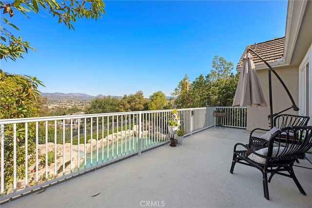 balcony featuring a mountain view