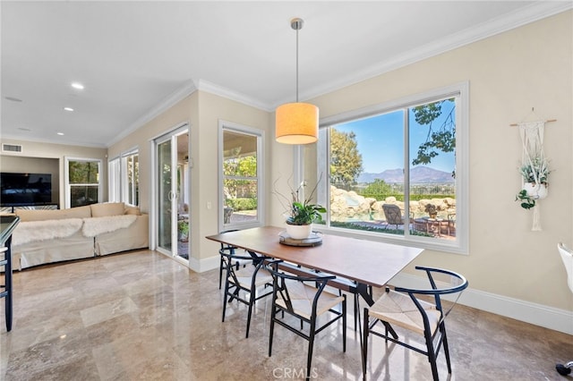 dining space with plenty of natural light, visible vents, baseboards, and crown molding