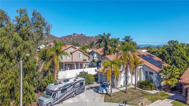 view of front of property with a residential view and a mountain view