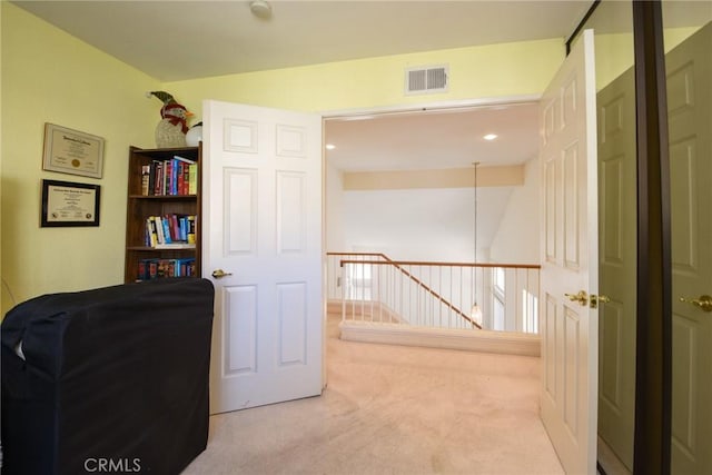 office featuring visible vents and light colored carpet