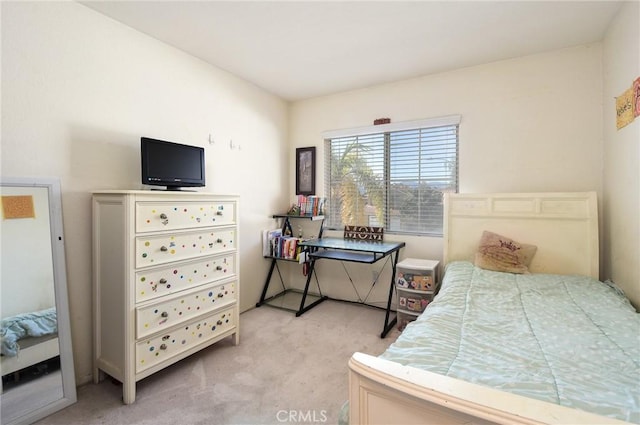 bedroom with light colored carpet