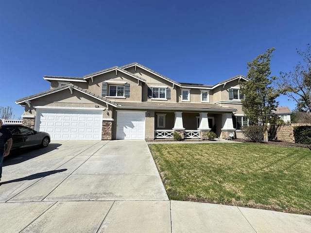 craftsman-style home with stucco siding, a porch, a front yard, stone siding, and driveway