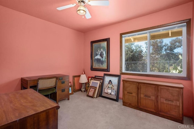 office with light carpet and a ceiling fan