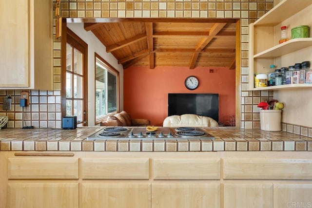 interior space with tile countertops, wooden ceiling, and backsplash