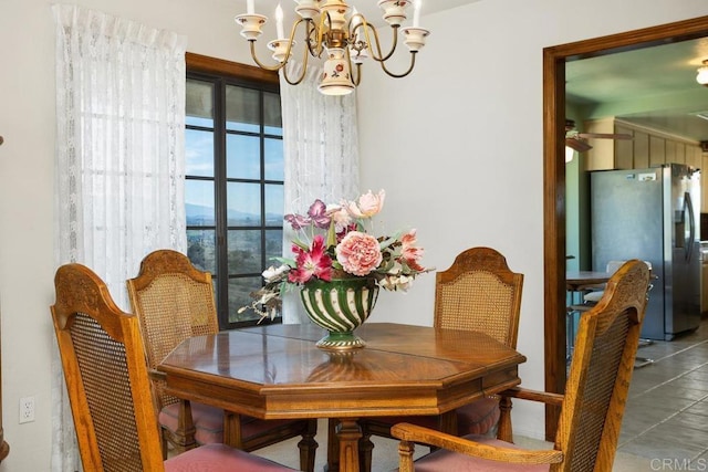 dining room with a notable chandelier