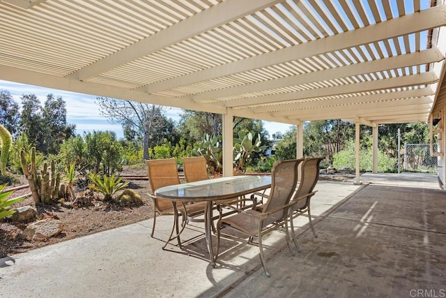 view of patio with outdoor dining space and a pergola