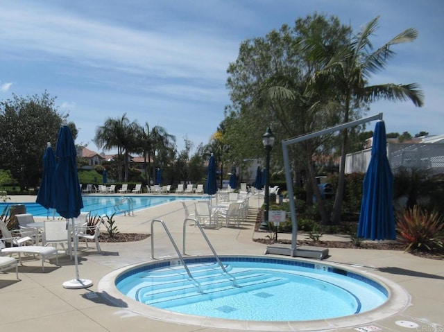 pool with a patio area