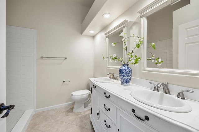 full bath with double vanity, tile patterned flooring, a sink, and toilet