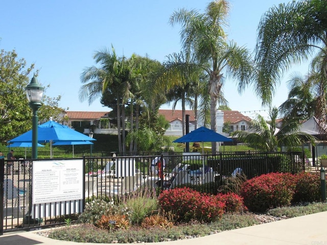 view of community with fence