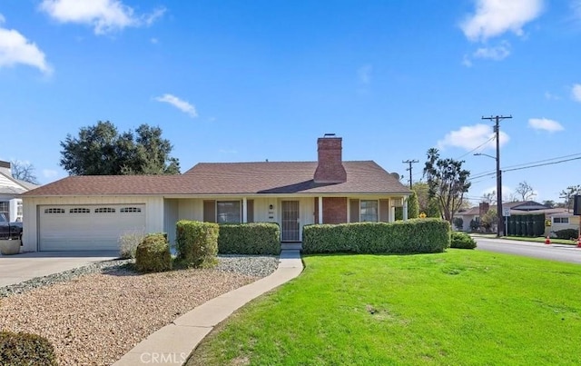 single story home featuring an attached garage, a chimney, concrete driveway, and a front yard