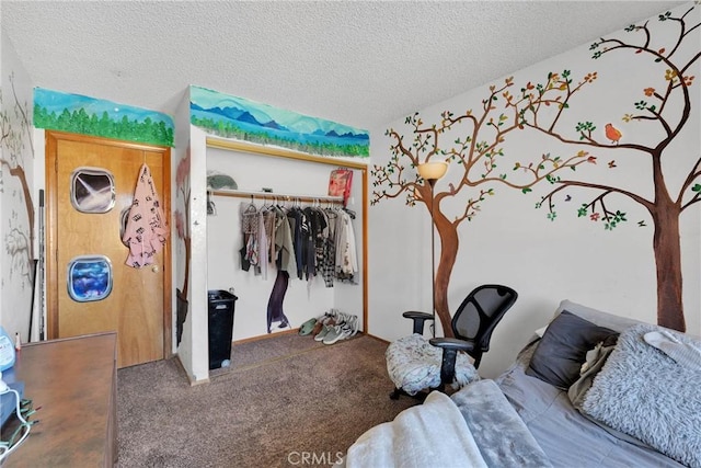 bedroom featuring a closet, carpet flooring, and a textured ceiling