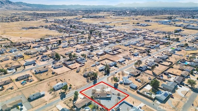 drone / aerial view with a residential view and a mountain view