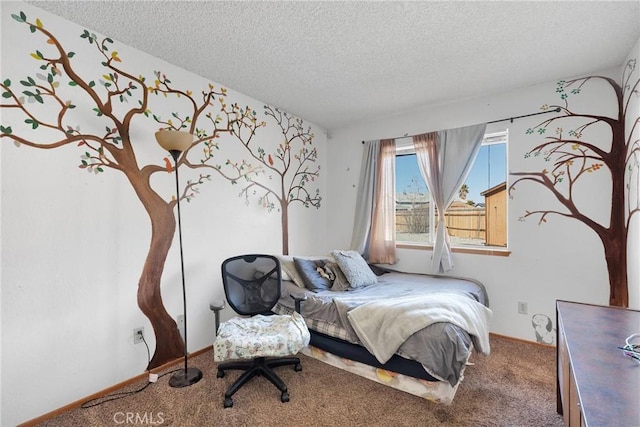 bedroom with carpet floors, baseboards, and a textured ceiling