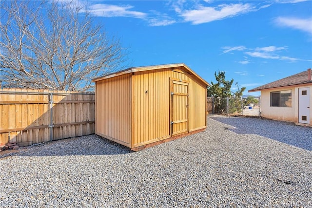 view of shed featuring a fenced backyard