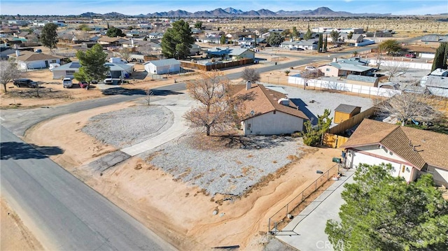 birds eye view of property with a residential view and a mountain view