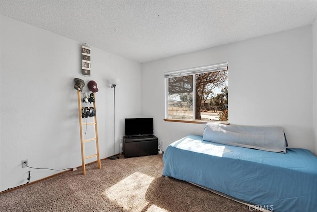 carpeted bedroom with a textured ceiling