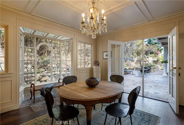 dining space featuring dark wood-style floors, coffered ceiling, and a decorative wall