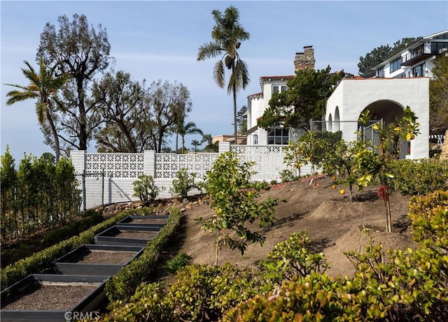 view of yard featuring a garden and fence