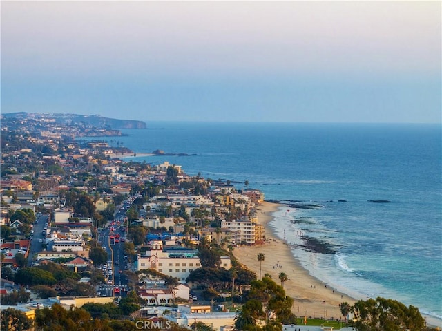 bird's eye view featuring a city view, a water view, and a beach view