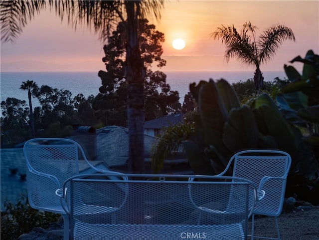 view of patio featuring a water view