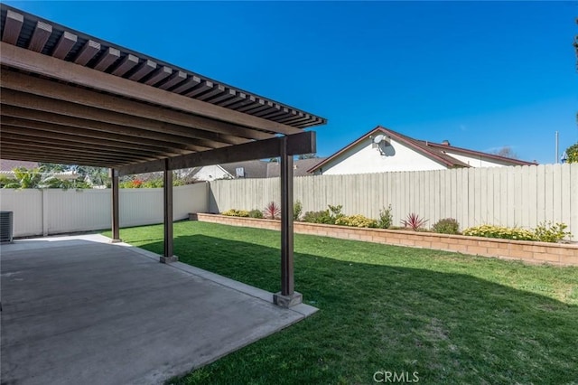 view of yard featuring a patio area, a fenced backyard, and cooling unit