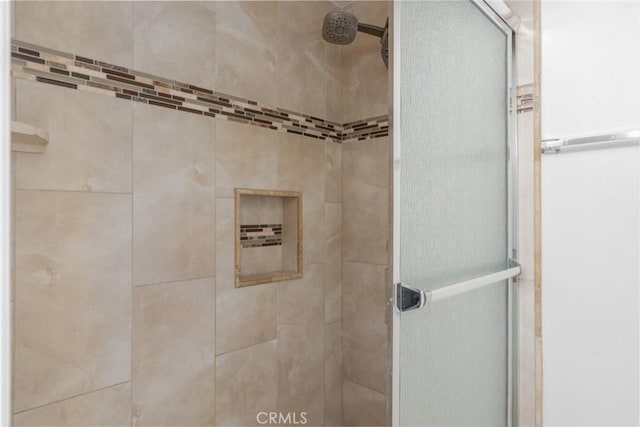 full bathroom featuring a shower stall