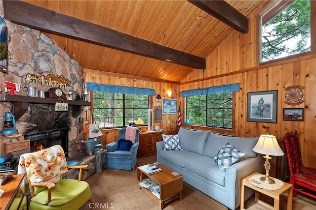 living area with carpet floors, vaulted ceiling with beams, wood walls, a stone fireplace, and wooden ceiling