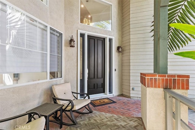 entrance to property with stucco siding