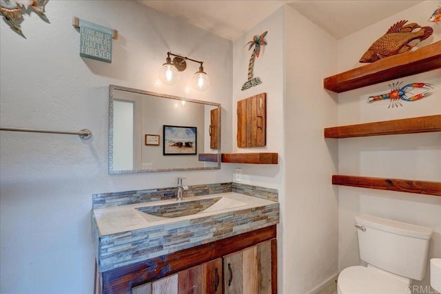 half bath with vanity and toilet