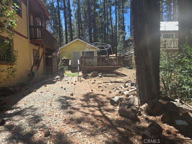 view of yard with a wooden deck