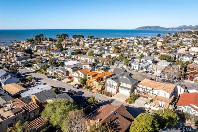 birds eye view of property featuring a water view and a residential view