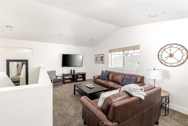 living area featuring baseboards, vaulted ceiling, and light colored carpet