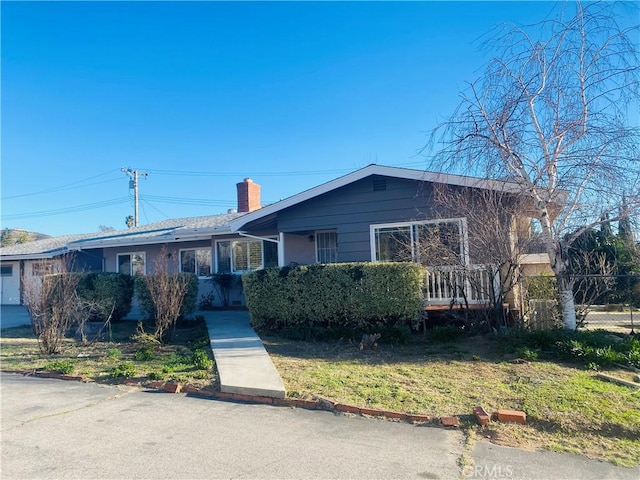 single story home with a chimney