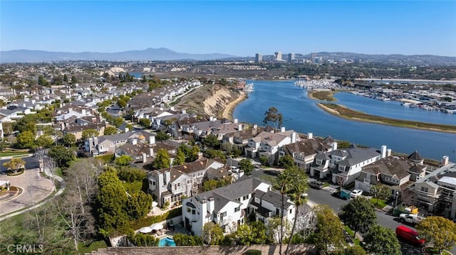 aerial view featuring a residential view and a water and mountain view