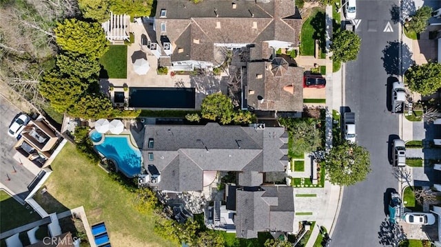 birds eye view of property with a residential view