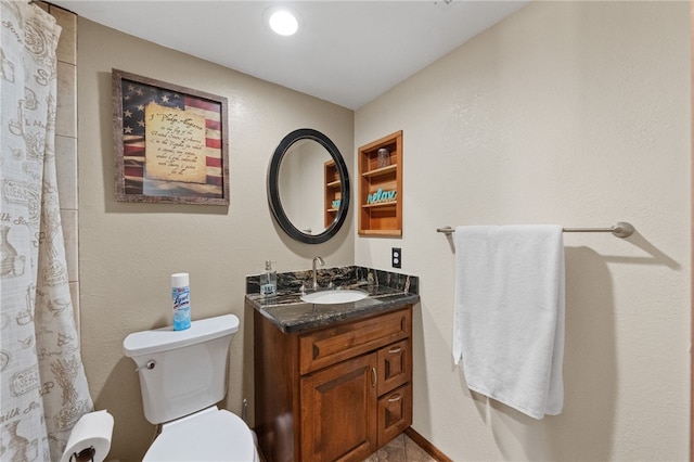 full bath featuring vanity and toilet