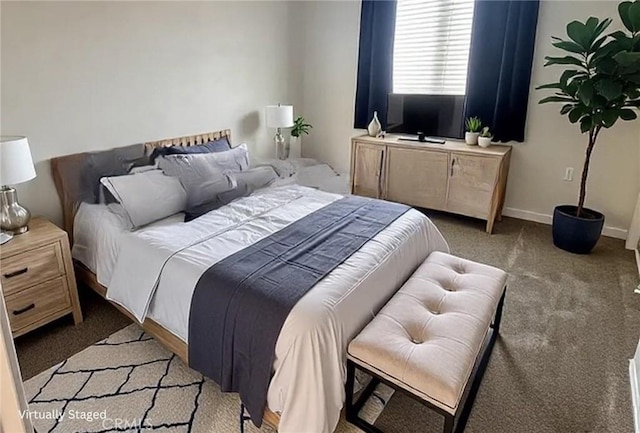 bedroom featuring baseboards and light colored carpet