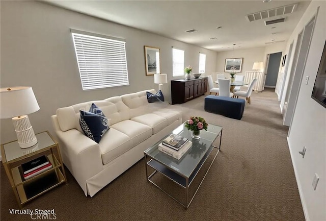 carpeted living area with visible vents