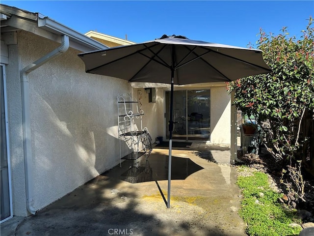 exterior space featuring stucco siding