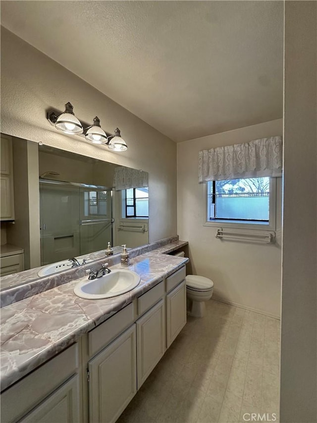 full bath with toilet, a shower stall, and vanity