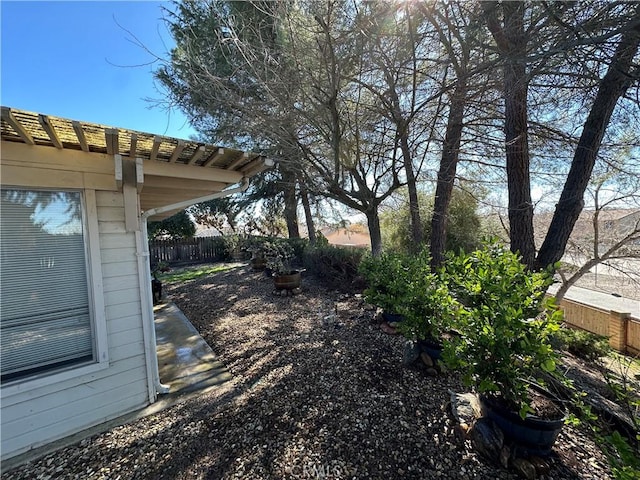 view of yard featuring fence