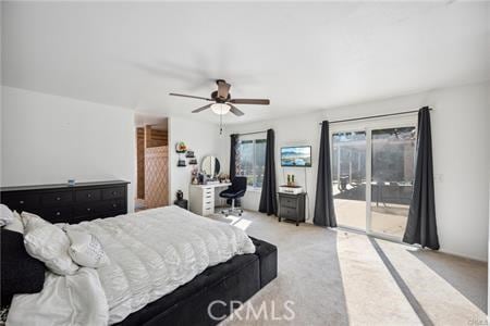 bedroom featuring access to exterior, a ceiling fan, and light colored carpet