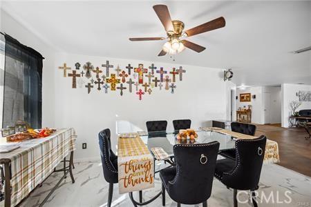 dining area featuring a ceiling fan