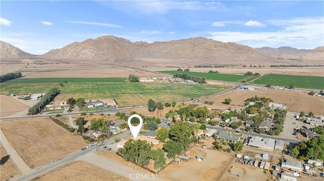 drone / aerial view featuring a rural view and a mountain view